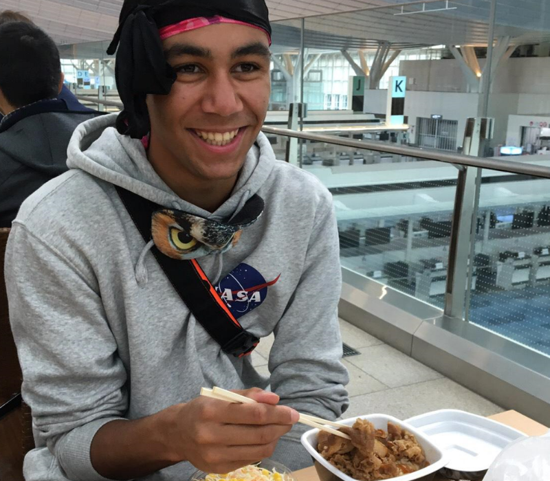 Ousmane eating first Japanese meal at airport